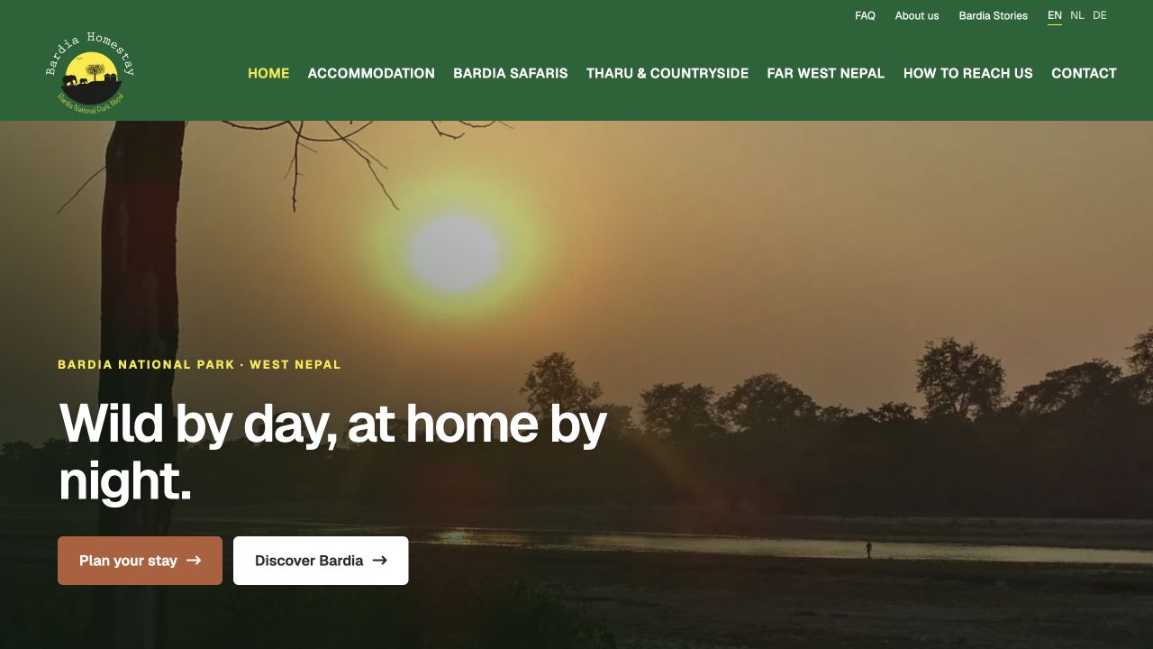 Nieuw ontwerp van Bardia Homestay met de kop "Wild by day, at home by night." over een zonsondergang in Bardia National Park